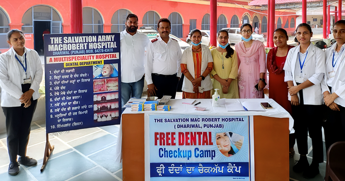 A group of people standing together at a hospital in India
