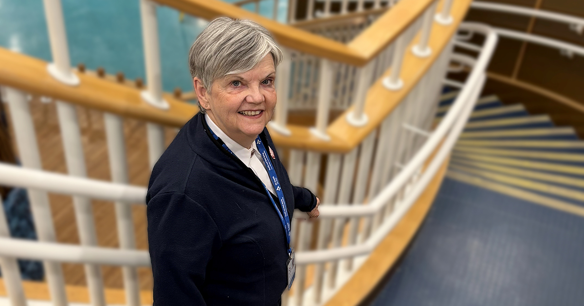 A woman standing on a staircase